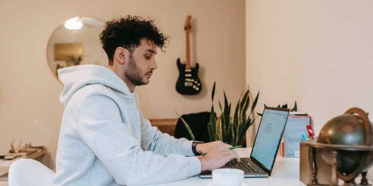 tired man working at computer