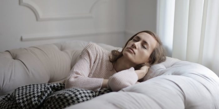 woman sleeping on couch