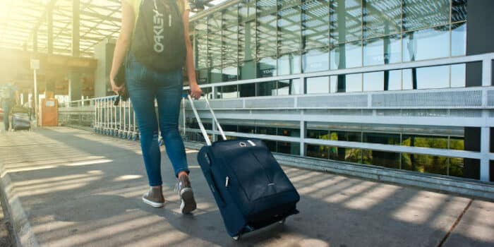 woman walking toward airport