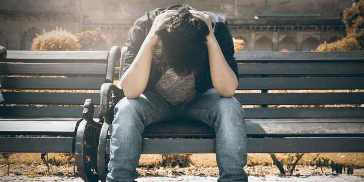 depressed teenager on a bench