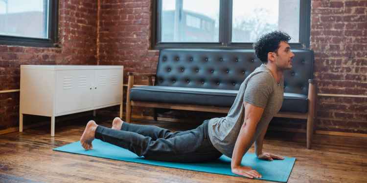 man practicing yoga