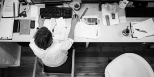 depressed man working at desk