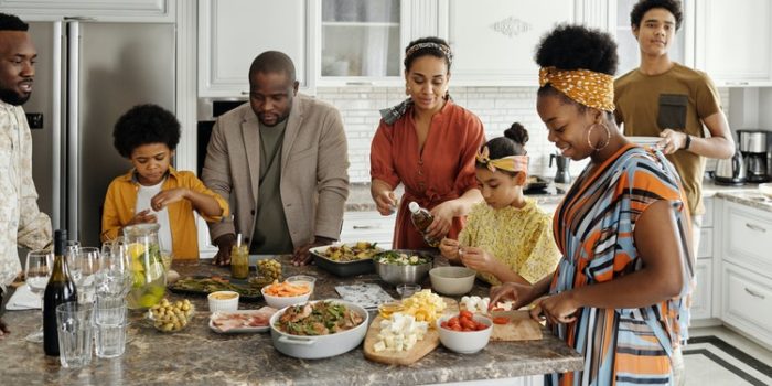 group of people together in a kitchen