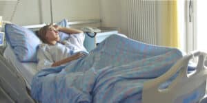 woman with eating disorder in hospital bed