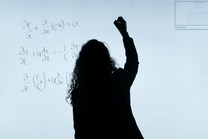 writing math equation on a whiteboard