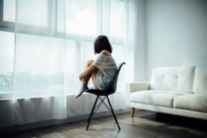 A person staring out of the window.