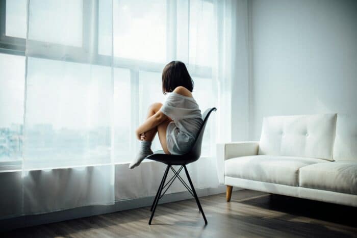 A person staring out of the window.