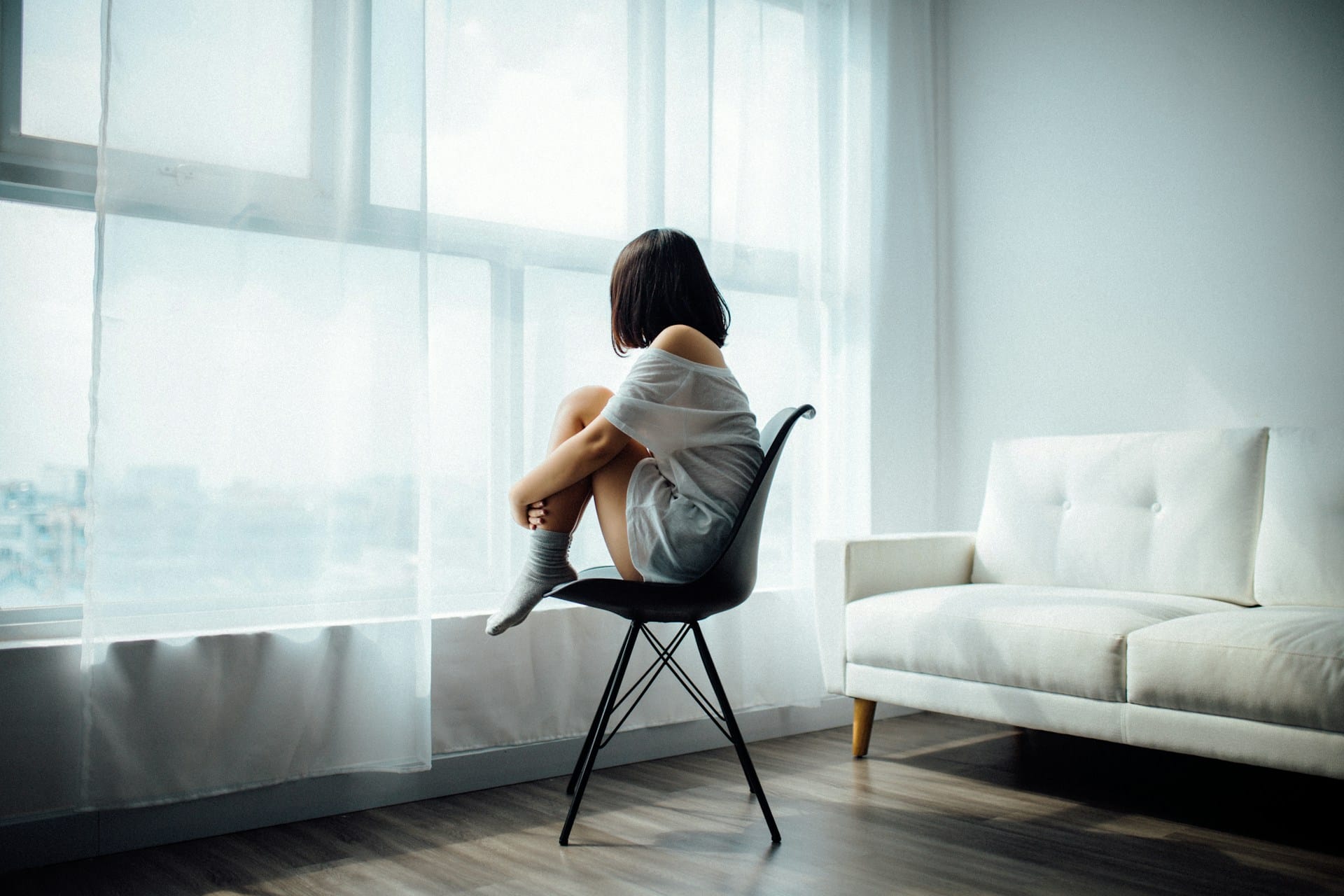 A person staring out of the window.