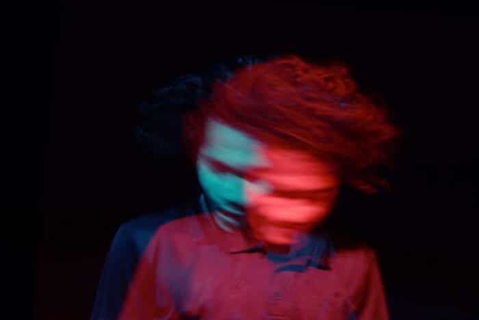 A person shaking their head