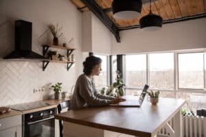 woman on her laptop engaged in a digital counseling session