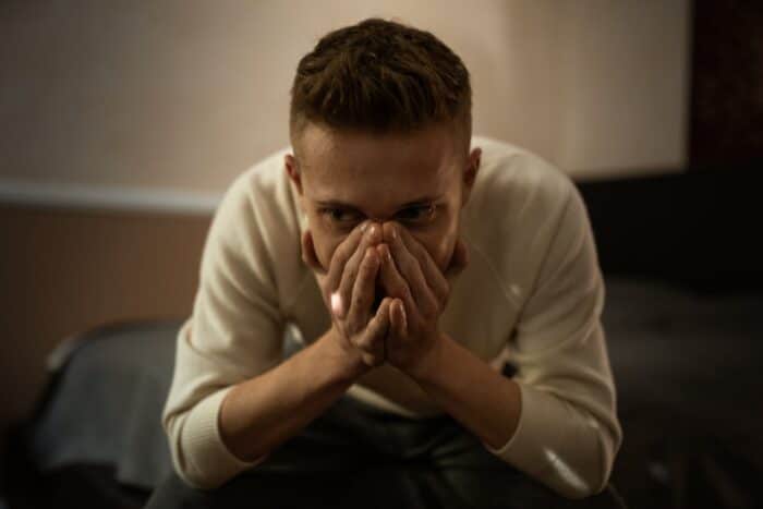 sad man sitting in contemplation