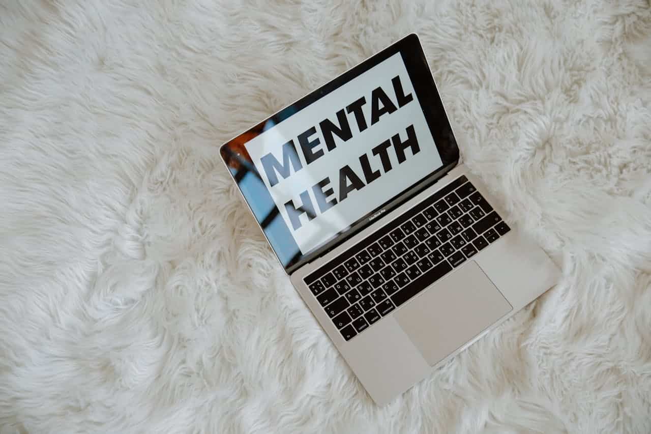 The Words Mental Health on Laptop Screen