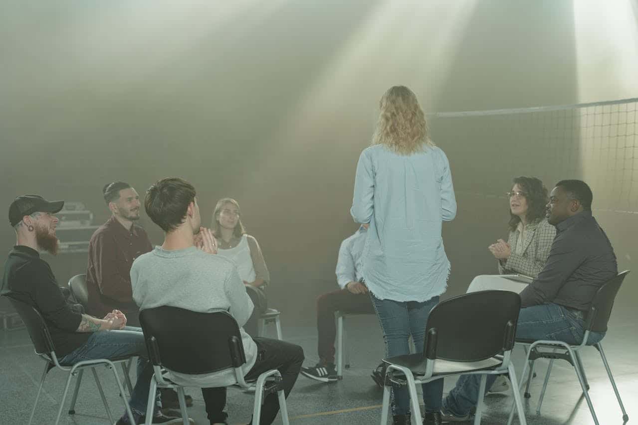 A diverse group in a therapy session indoors