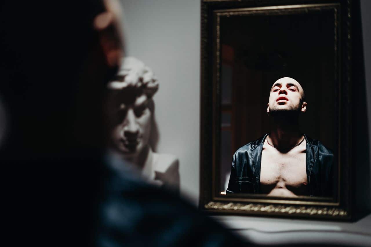 portrait of a man reflecting in a mirror