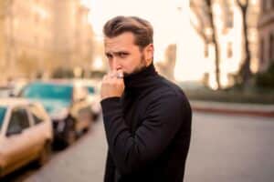 man in street experiencing severe anxiety
