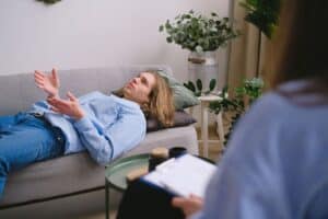 man on couch in therapy session