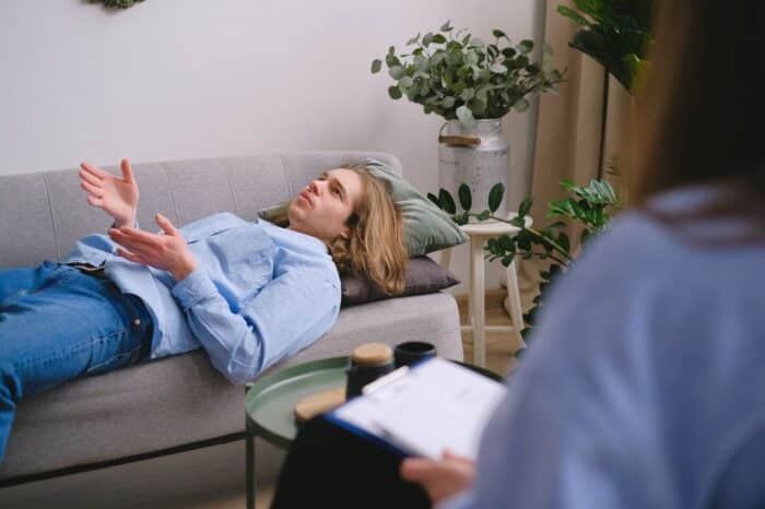 man on couch in therapy session