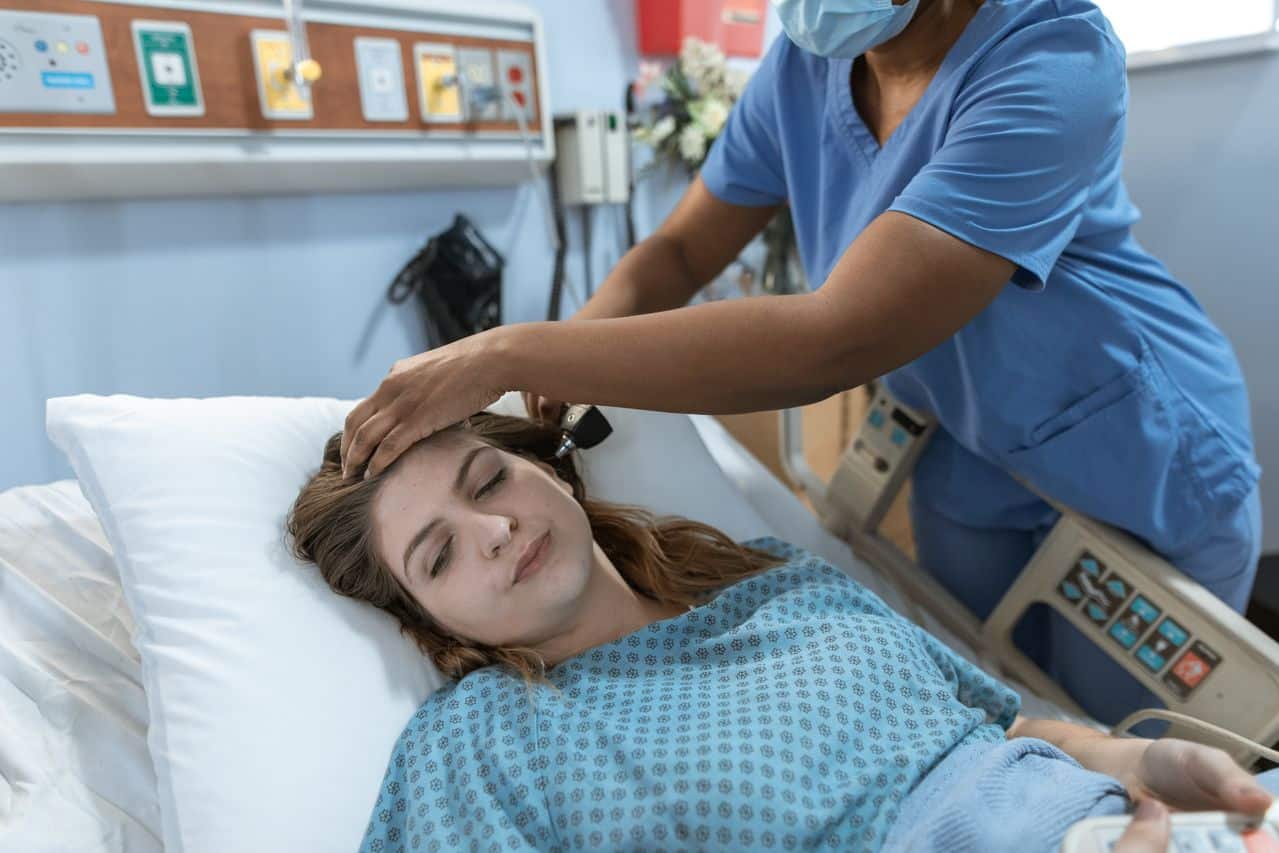 nurse tending to a patient